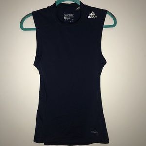 Sleeveless navy adidas compression shirt.